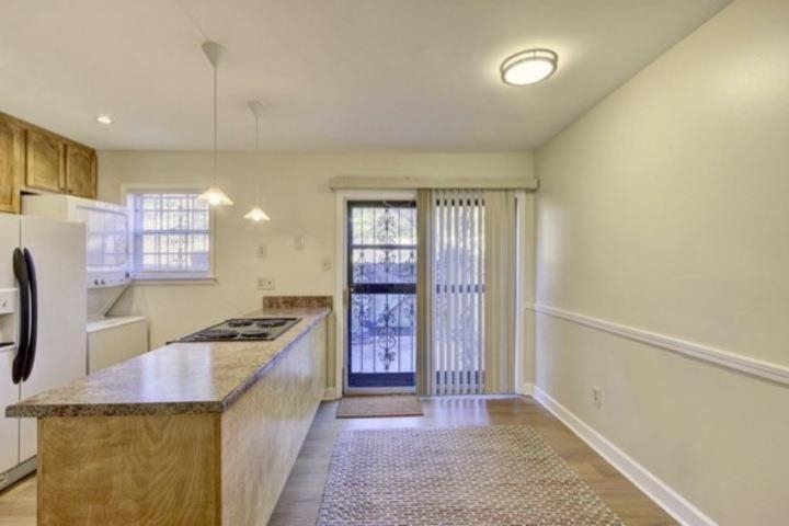 5718 Quince Road, Unit 10 Memphis, TN 38119 - Photo 6 of 28 a kitchen with stainless steel appliances granite countertop a stove and a refrigerator