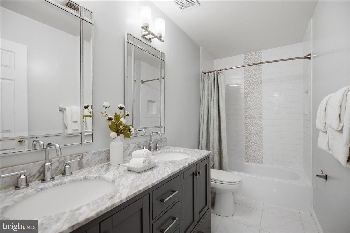 2424 Springbrook Court Huntingtown, MD 20639 - Photo 64 of 103 a bathroom with a granite countertop sink toilet and shower