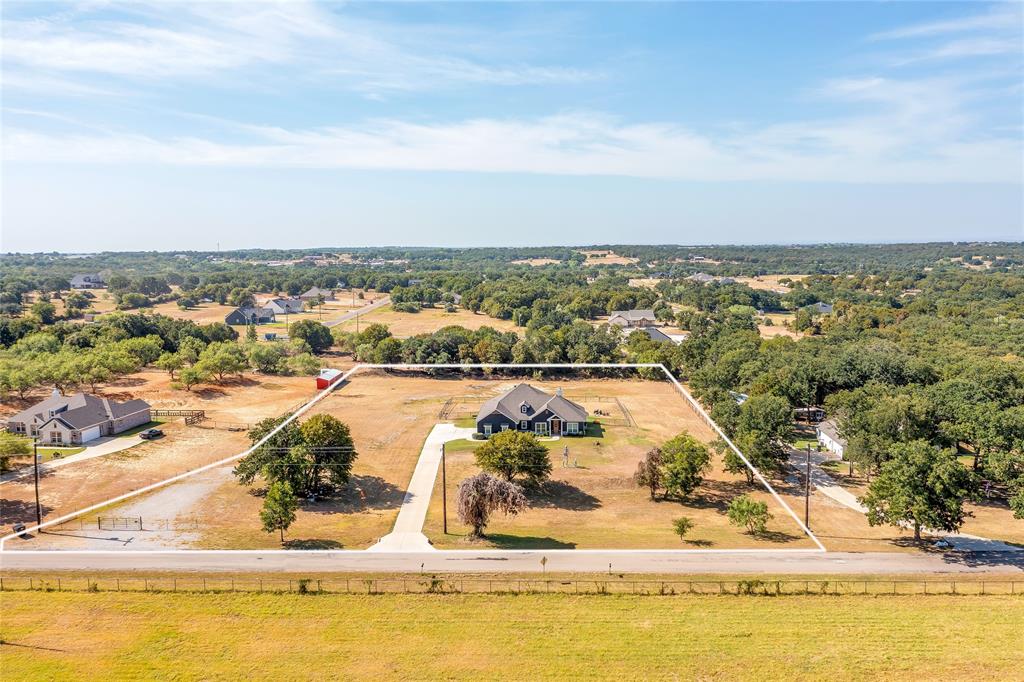 492 Clark Lake Road Weatherford, TX 76088 - Photo 38 of 38 Expansive property featuring a single-story residence, a defined driveway, and mature trees within the perimeter