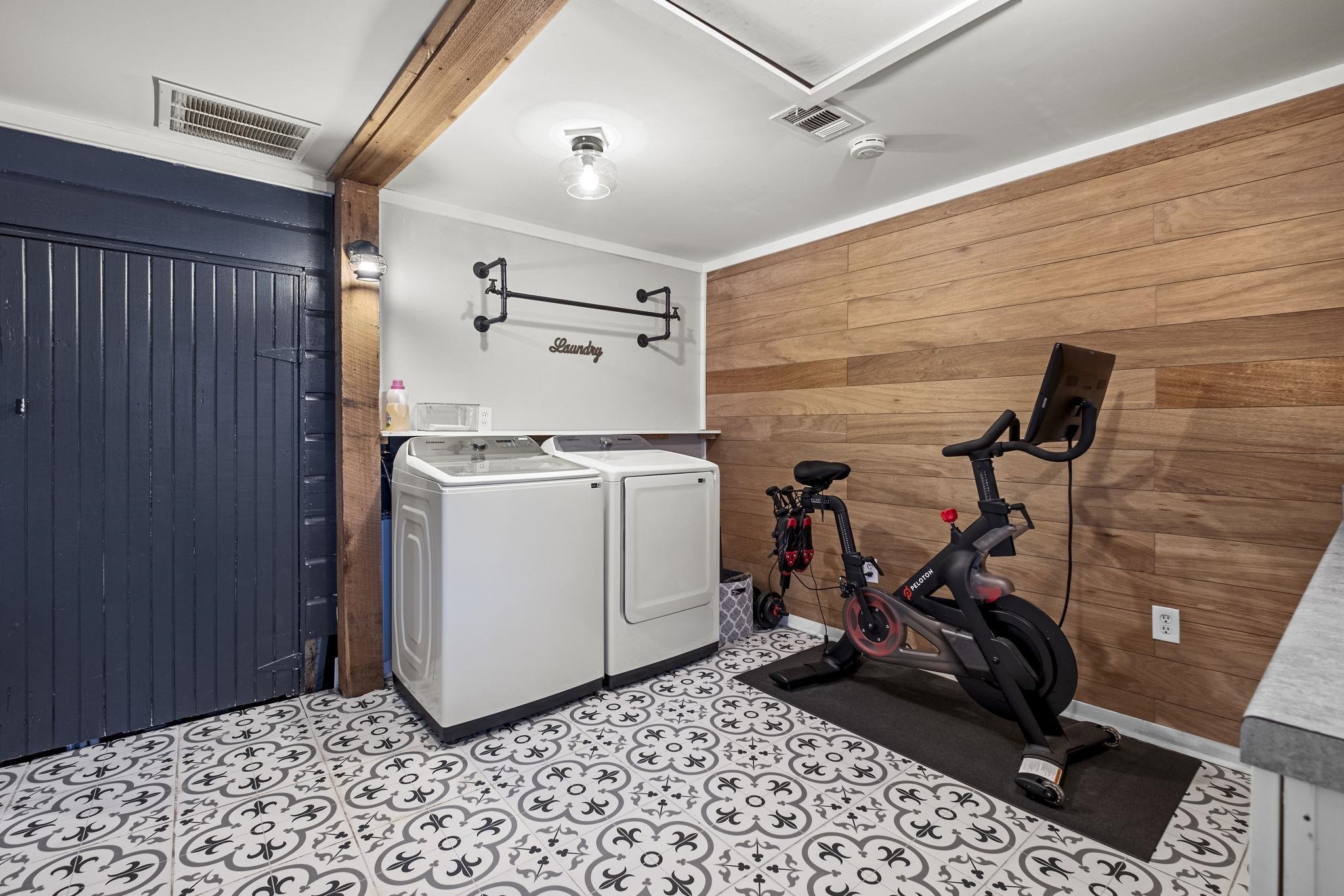 4120 Village Road Memphis, TN 38117 - Photo 25 of 28 Laundry area featuring wooden walls, ornamental molding, and washing machine and dryer