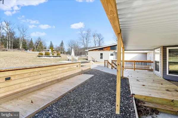 a view of a balcony with wooden floor