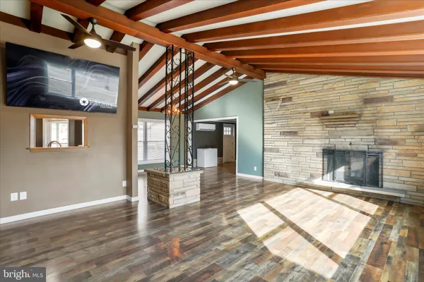 a view of livingroom with wooden floor and fireplace