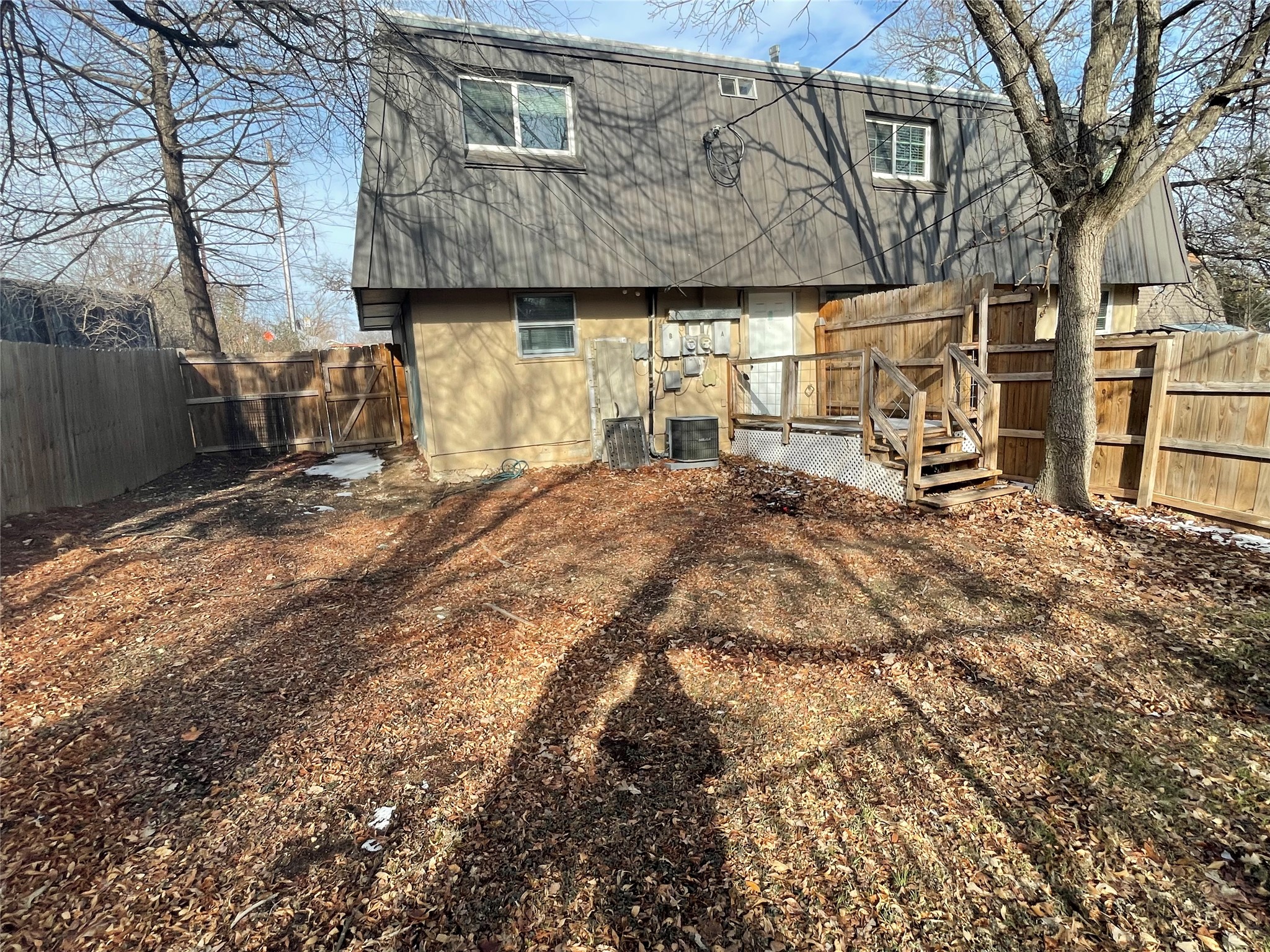 6253 Manor Road, Unit B Austin, TX 78723 - Photo 9 of 10 Back of house with a fenced backyard and a deck