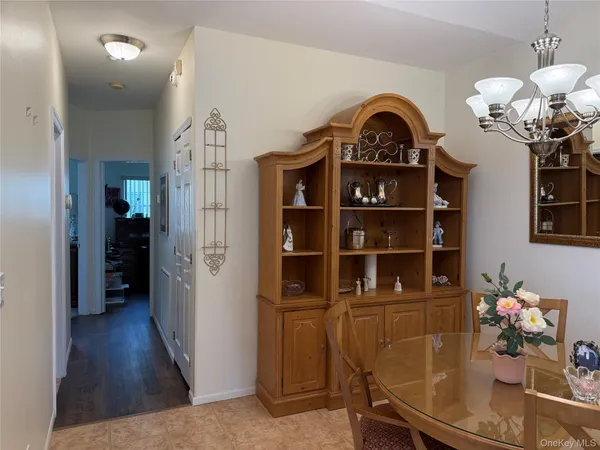 a view of a living room with furniture and wooden floor
