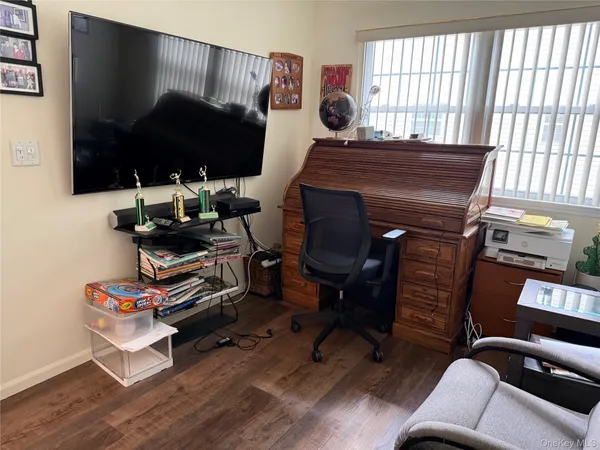 a room with furniture and a flat screen tv