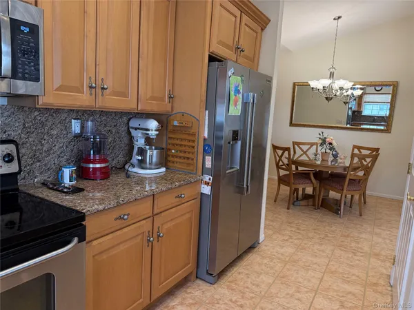 a living room with granite countertop furniture and a dresser