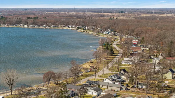 an aerial view of residential building and ocean