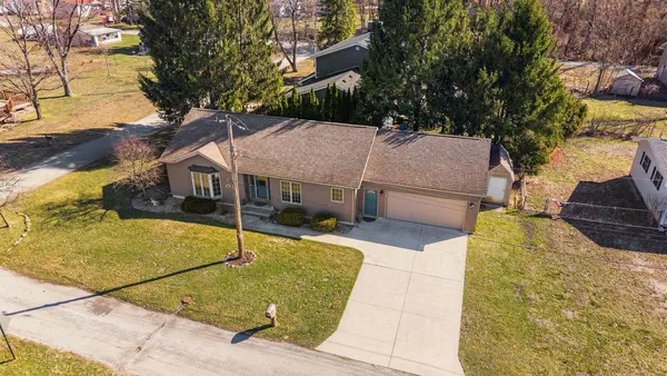 a view of a house with basketball court