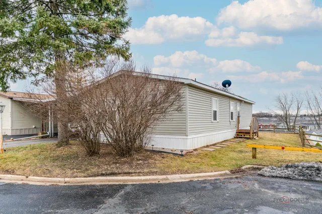 a view of deck with wooden floor and fence and a window