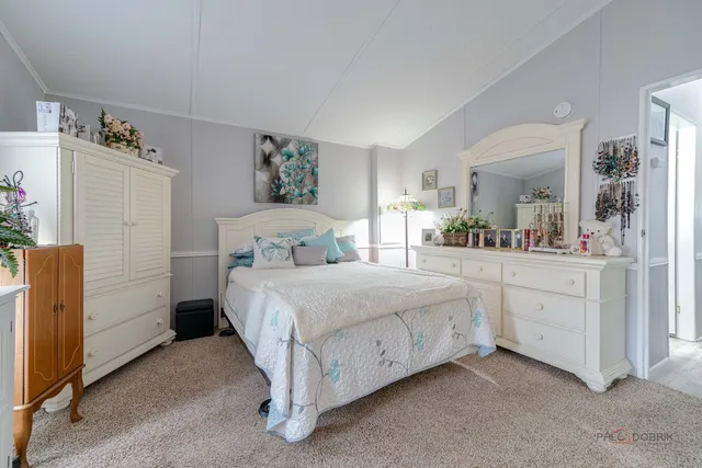 a bedroom with a bed and a cabinets