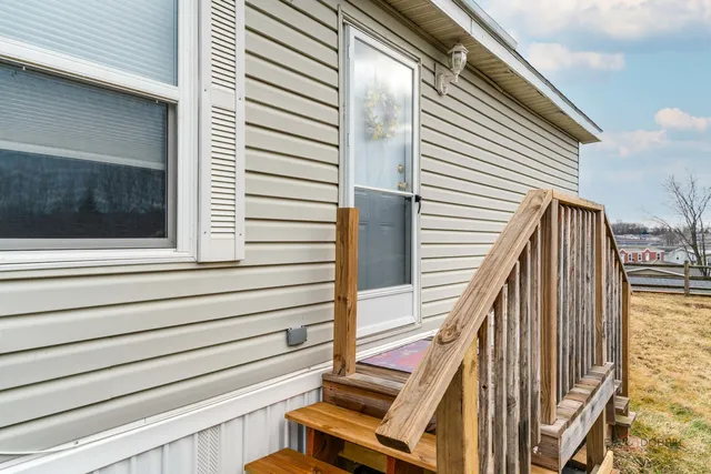 a view of deck with wooden floor and fence and a window