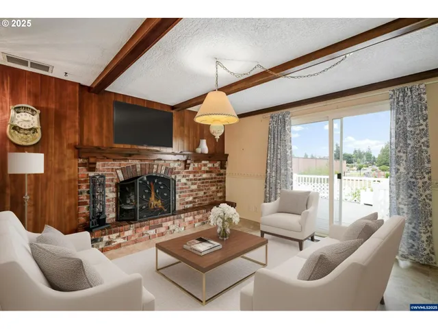 a living room with furniture a fireplace and a flat screen tv