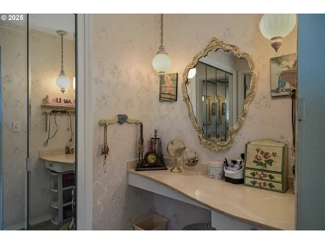 a bathroom with a sink mirror and vanity