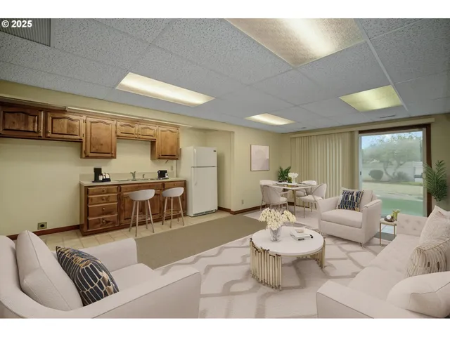 a bedroom with a large bed and a potted plant