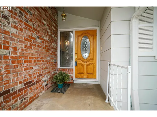 a view of a door and front view of a house