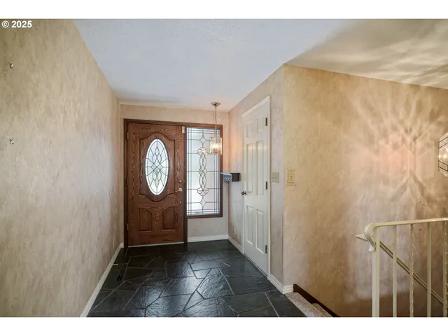 a view of entryway with wooden floor