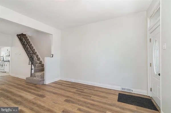 a view of entryway with wooden floor