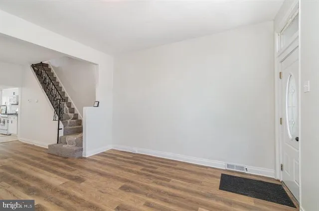 a view of entryway with wooden floor