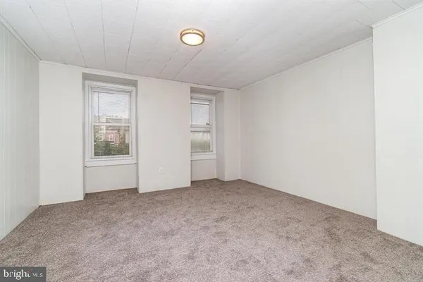 an empty room with windows