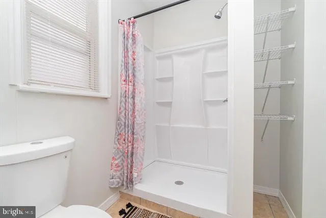 a bathroom with a sink a mirror and a shower