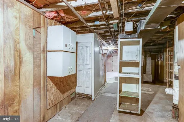 a view of an empty room with a cabinet