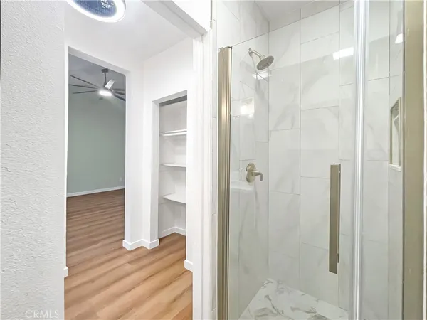 a bathroom with a glass shower door