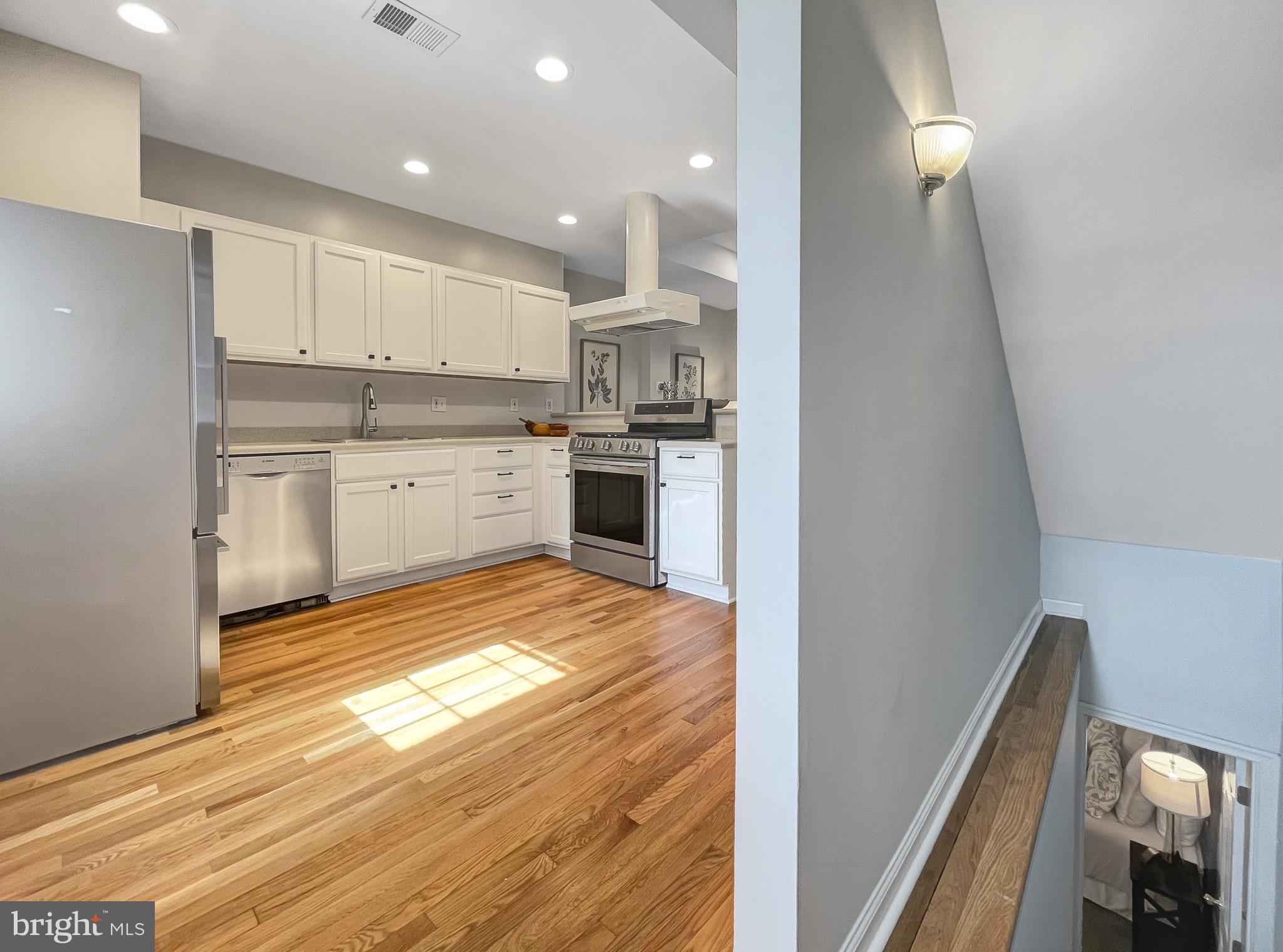 56 R Street Northwest Washington, DC 20001 - Photo 16 of 64 Bright kitchen accented with recessed lighting