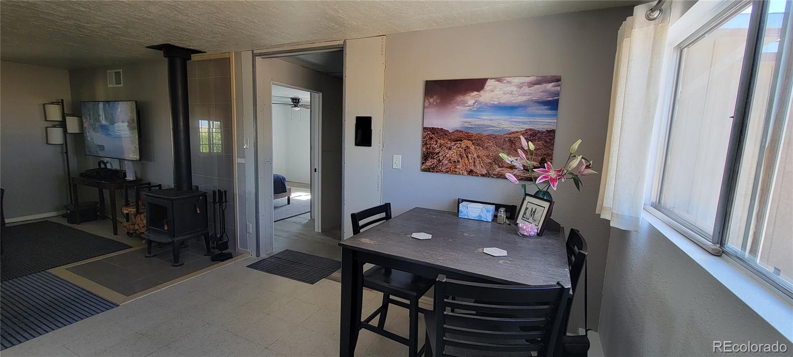 8246 Manitou Springs Road Blanca, CO 81123 - Photo 12 of 43 a view of a room with furniture and wooden floor