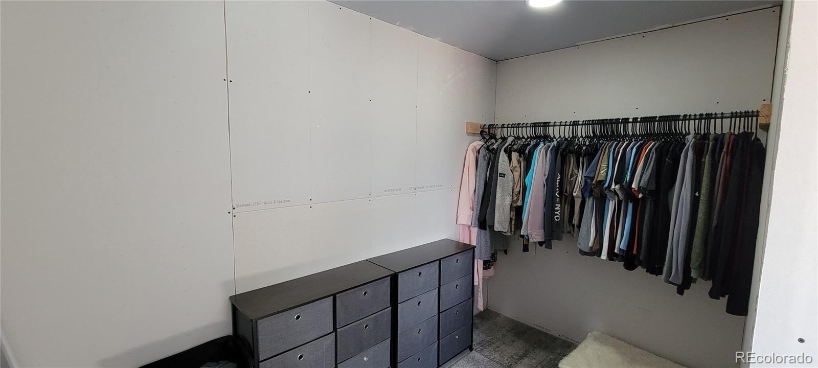 8246 Manitou Springs Road Blanca, CO 81123 - Photo 14 of 43 a view of walk in closet with clothes