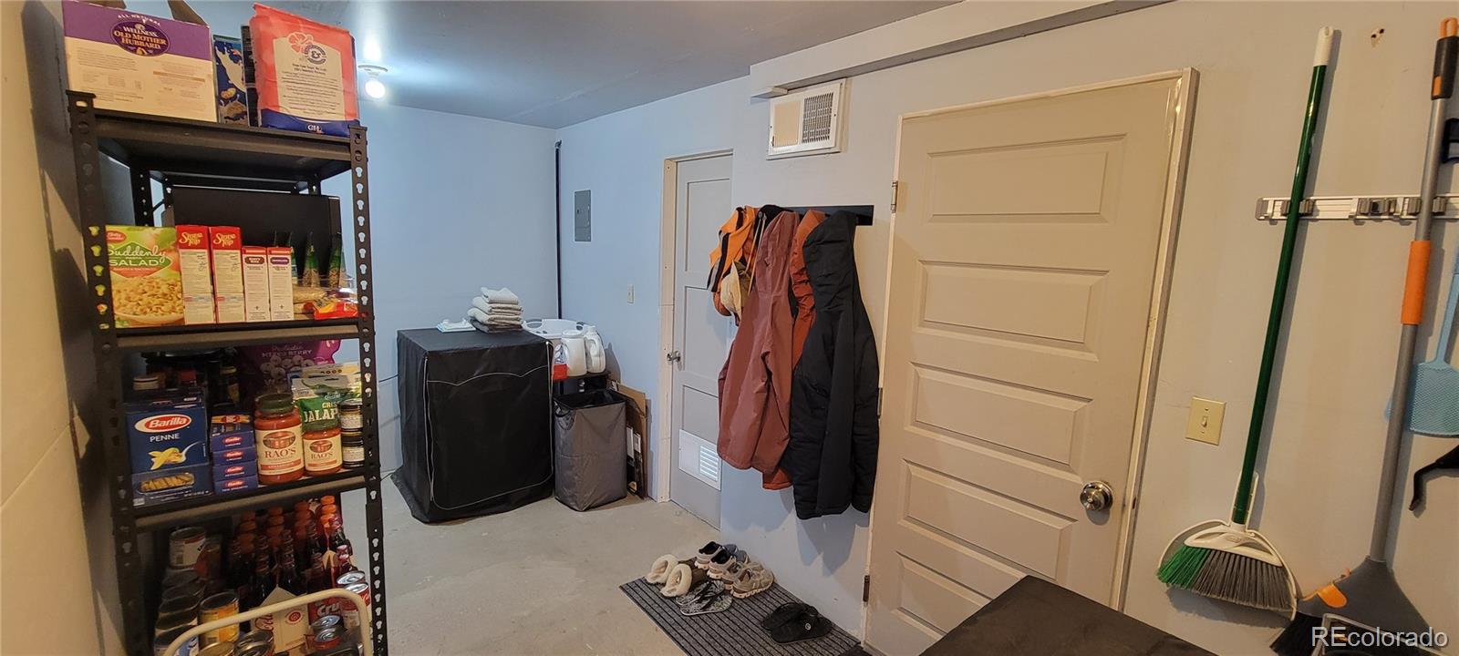 8246 Manitou Springs Road Blanca, CO 81123 - Photo 16 of 43 a view of walk in closet with clothes and shoes