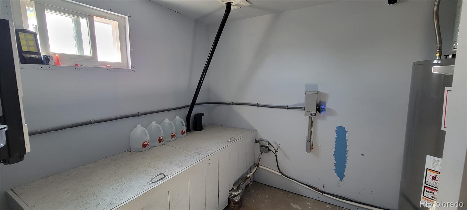 8246 Manitou Springs Road Blanca, CO 81123 - Photo 20 of 43 a utility room with dryer and washer