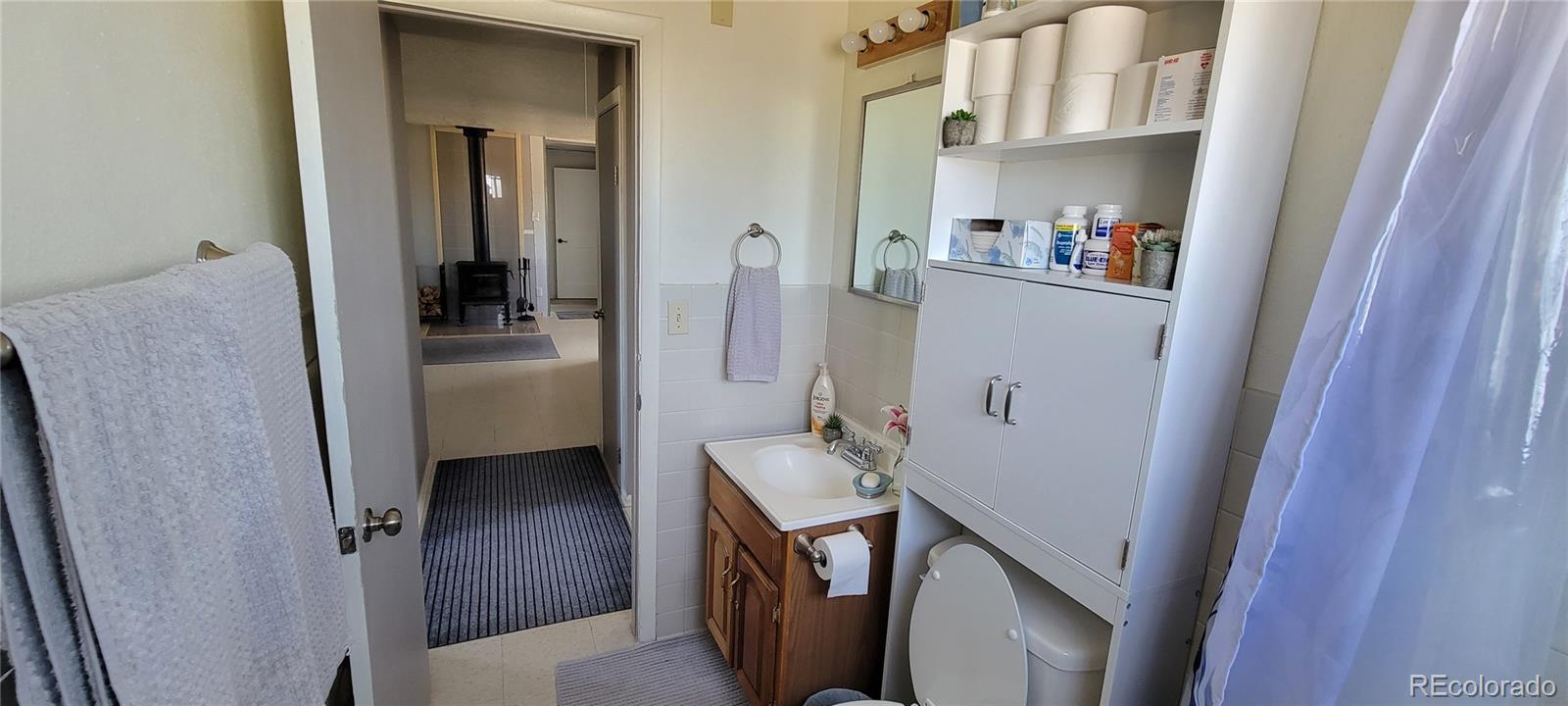 8246 Manitou Springs Road Blanca, CO 81123 - Photo 26 of 43 a room with wooden door and furniture