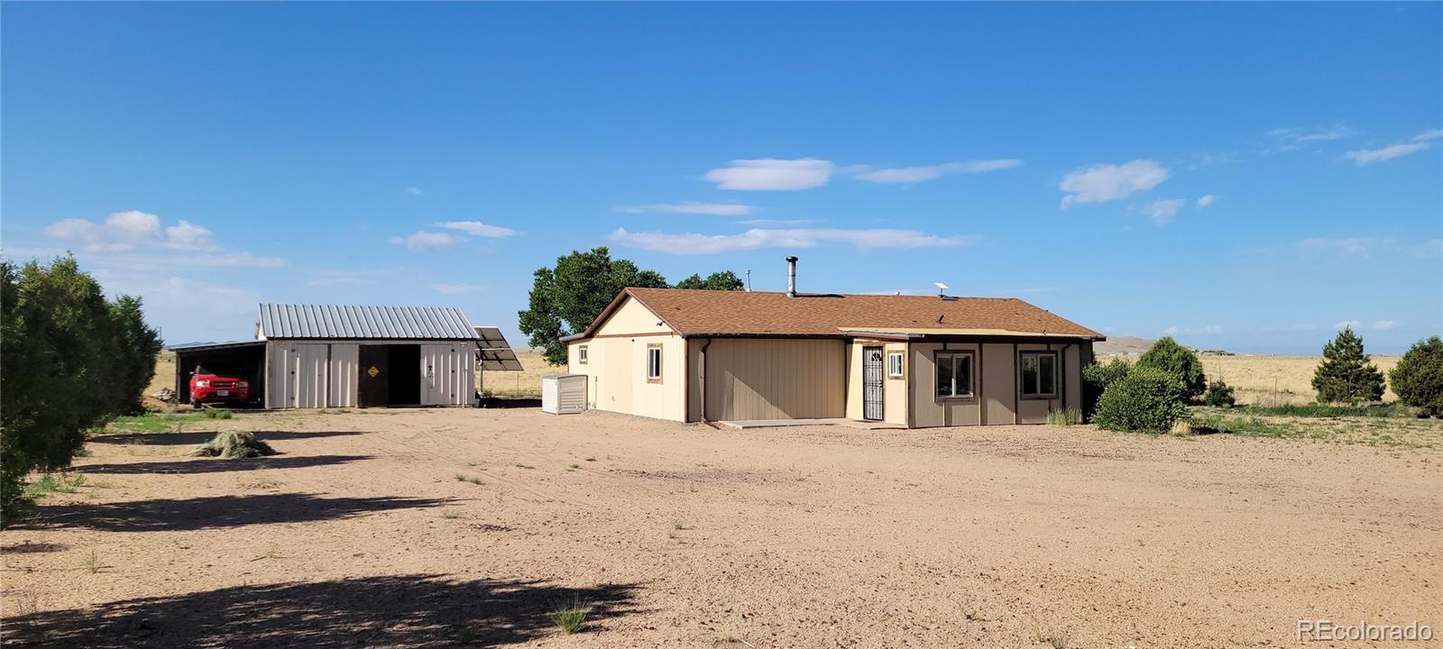 8246 Manitou Springs Road Blanca, CO 81123 - Photo 36 of 43 a view of a house with a snow on the road