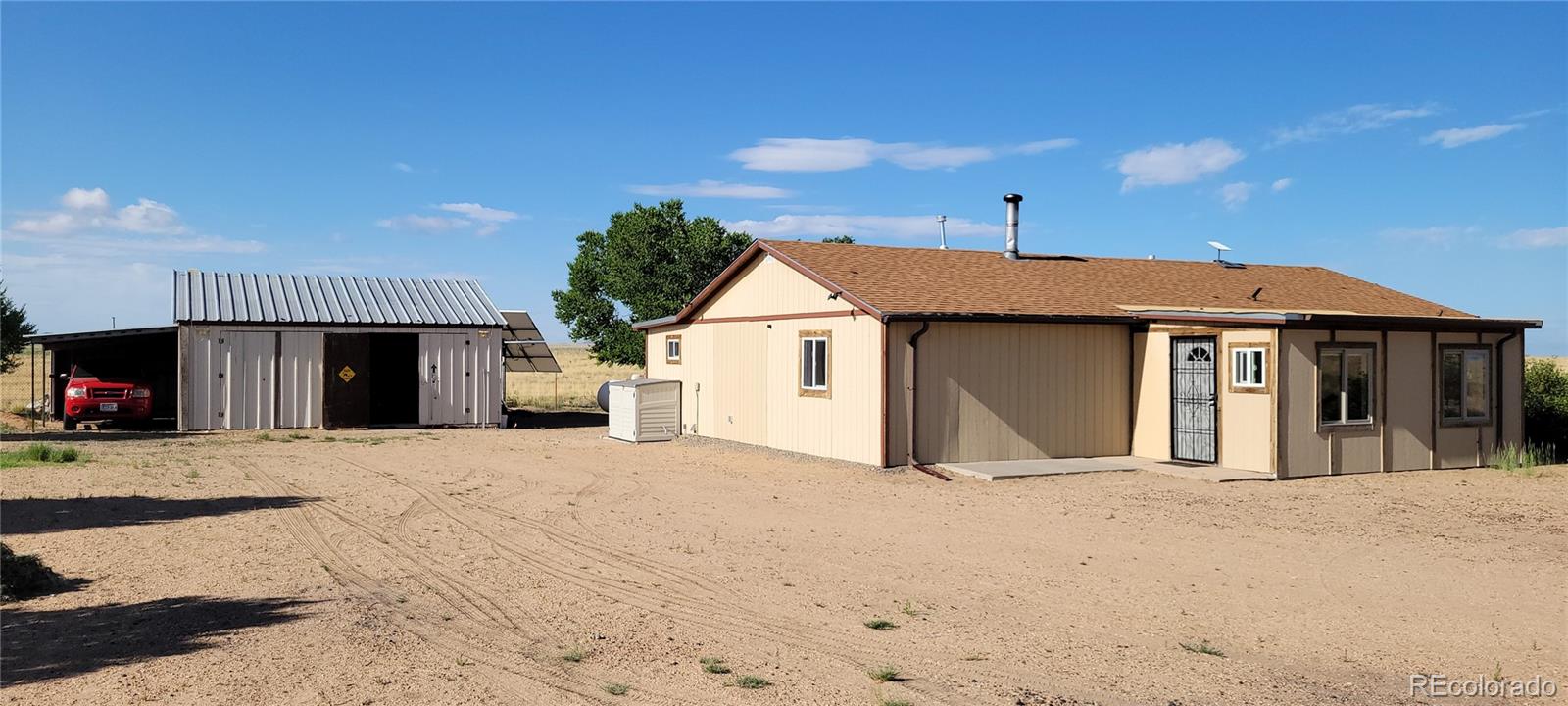 8246 Manitou Springs Road Blanca, CO 81123 - Photo 37 of 43 a view of a house with a outdoor space