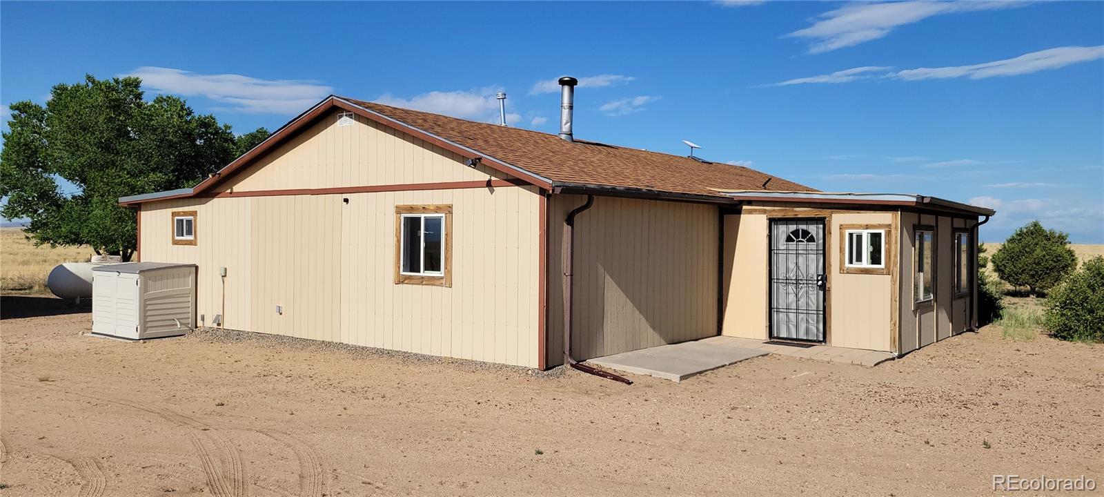 8246 Manitou Springs Road Blanca, CO 81123 - Photo 38 of 43 a view of a house with garage