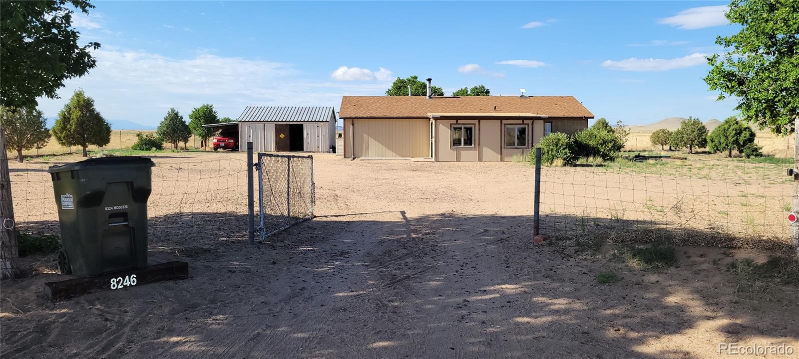 8246 Manitou Springs Road Blanca, CO 81123 - Photo 4 of 43 a front view of a house with a yard