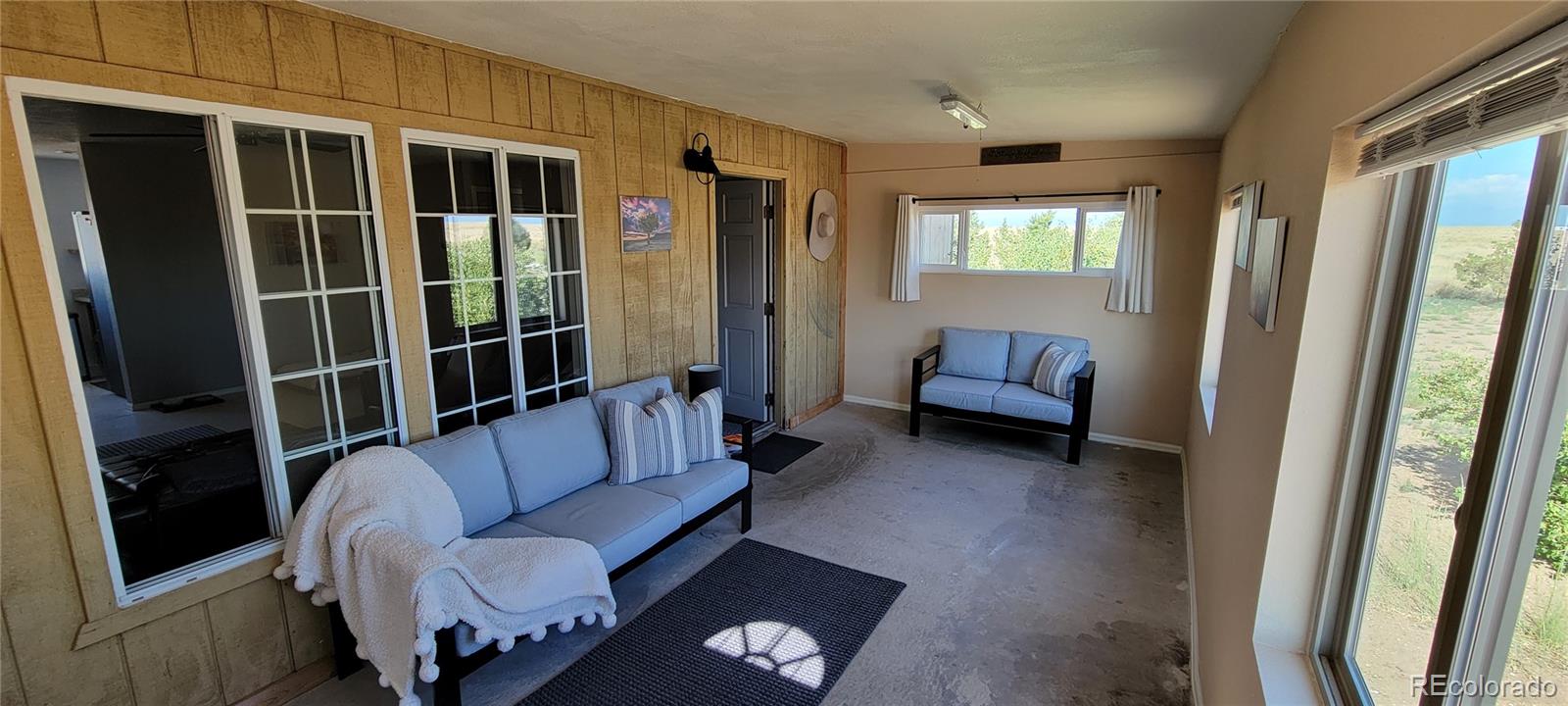 8246 Manitou Springs Road Blanca, CO 81123 - Photo 5 of 43 a living room with furniture and a window