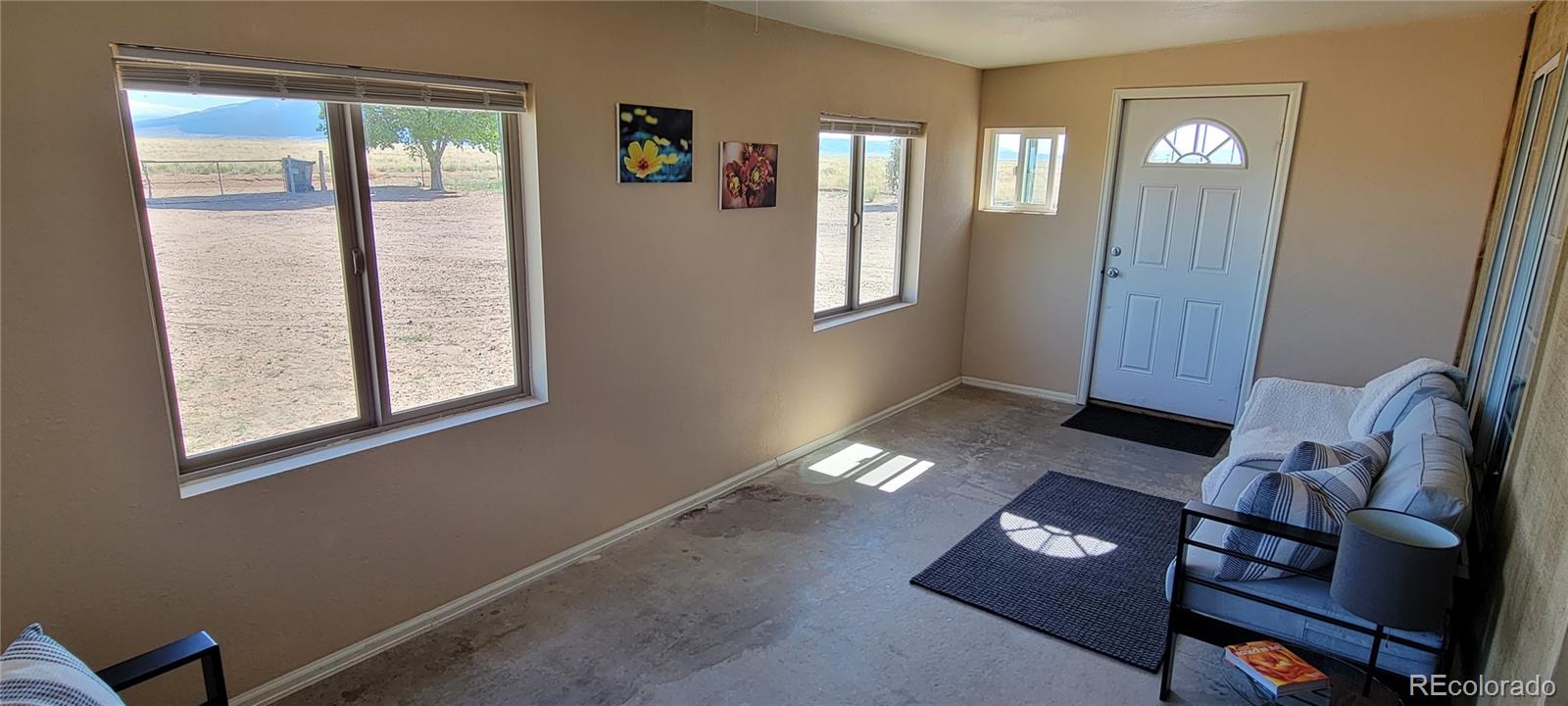 8246 Manitou Springs Road Blanca, CO 81123 - Photo 6 of 43 a view of livingroom with furniture and window