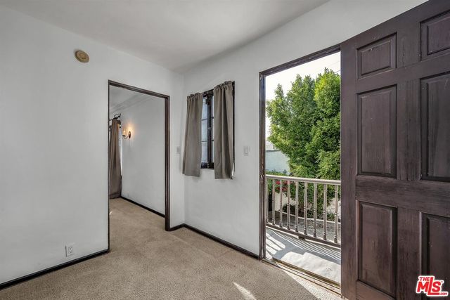 a view of a balcony with wooden floor