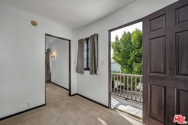 a view of a balcony with wooden floor