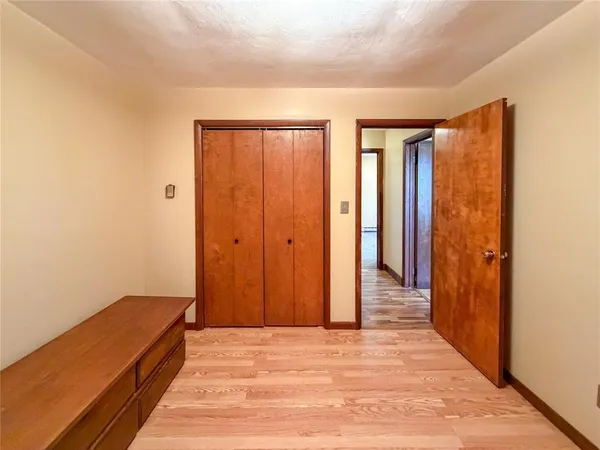 a view of a room with wooden floor and staircase