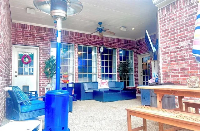 a view of a room with furniture and a potted plant