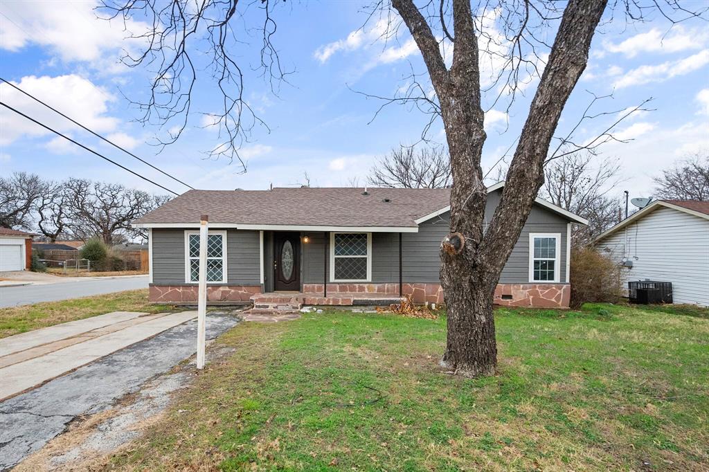 front view of a house with a yard