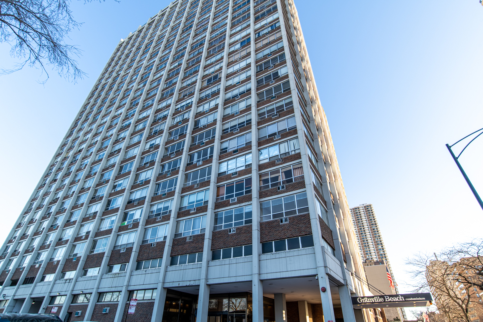 6171 North Sheridan Road, Unit 2404 Chicago, IL 60660 - Photo 1 of 16 a front view of a building
