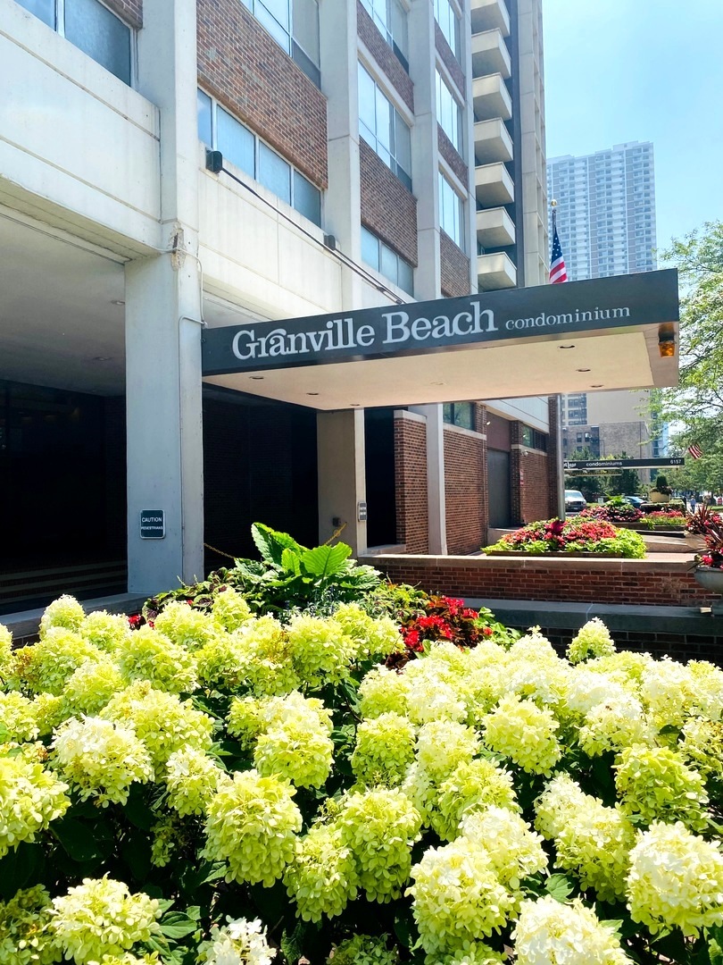 6171 North Sheridan Road, Unit 2404 Chicago, IL 60660 - Photo 16 of 16 a front view of building with flowers