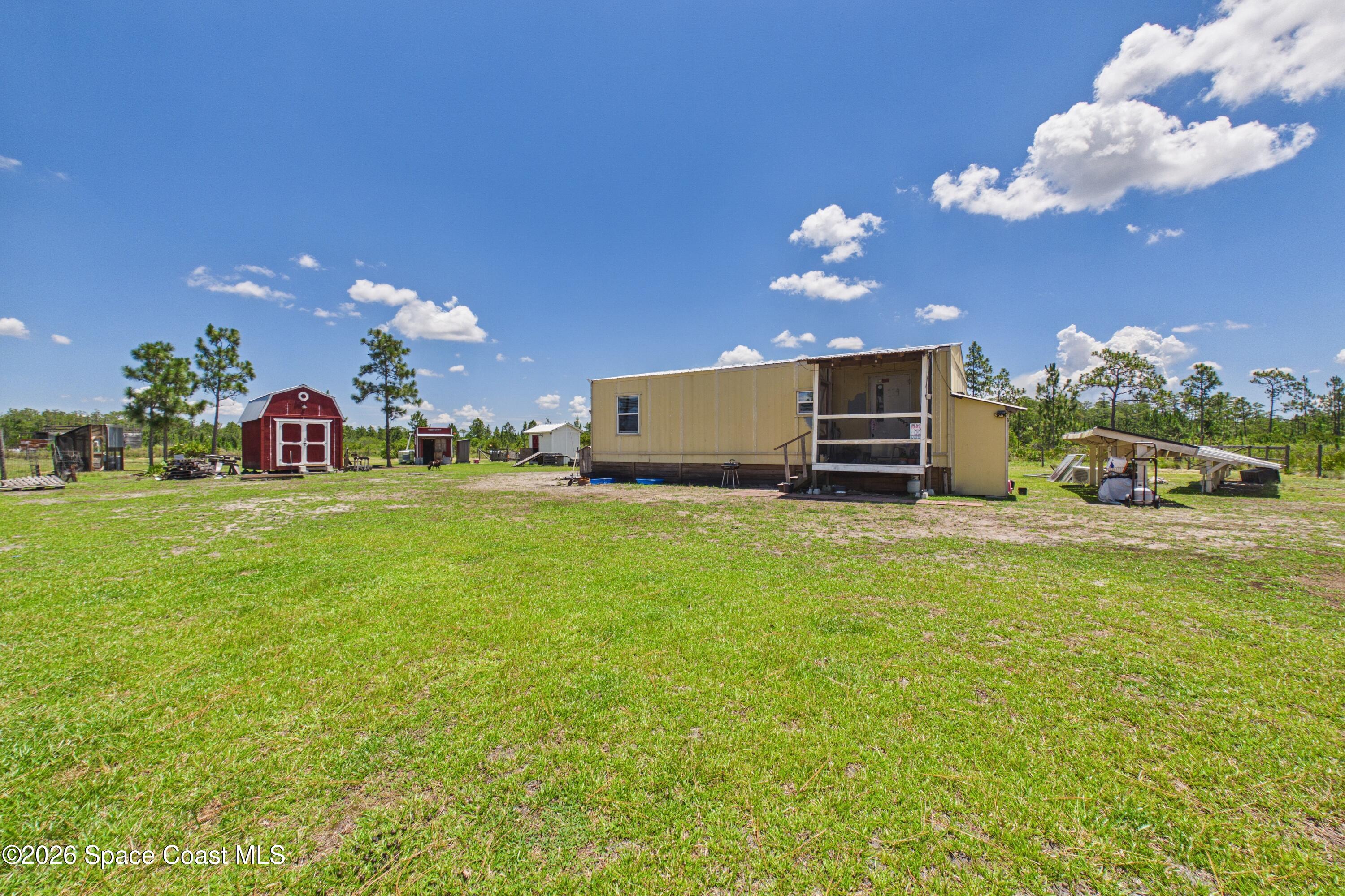 100 Holopaw Groves Rd Street St. Cloud, FL 34773 - Photo 5 of 21 CAM06582G6-PR0011-STILL050