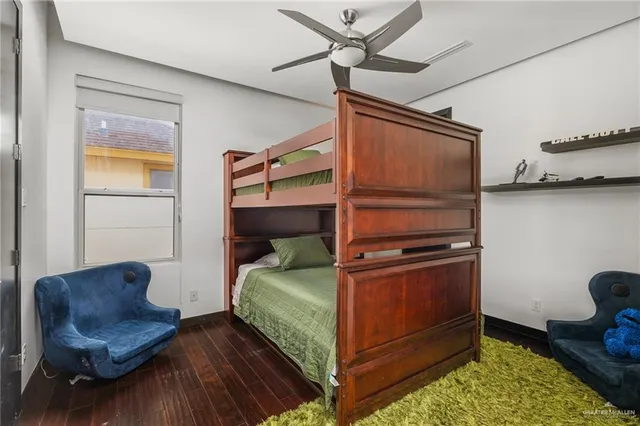 a bedroom with a bed and a chair