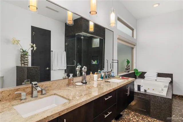 a bathroom with a sink double vanity and a mirror