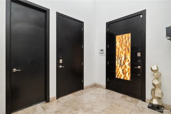 a bedroom with window and furniture