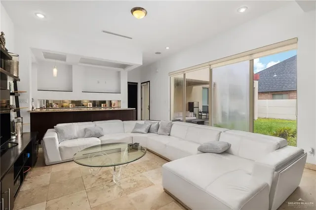 a living room with furniture and a large window
